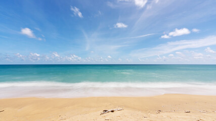 Phuket Thailand Summer background of sandy beach Amazing sea clear blue sky and white clouds Wave crashing on sandy shore