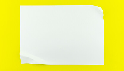 White sheet paper on yellow paper background copy space for your text advertising