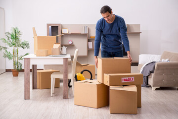 Fototapeta premium Young man moving to new flat