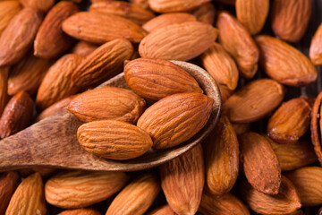 Delicious roasted sweet almonds nuts  background
