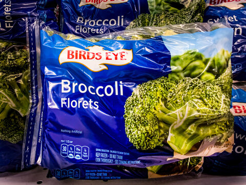 Shiloh, IL-July 10, 2021; plastic bag of frozen Broccoli branded as Birds Eye rand vegetables sits in grocery store freezer.