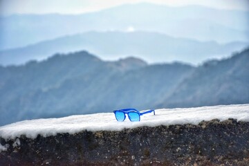 Sunglass on snow