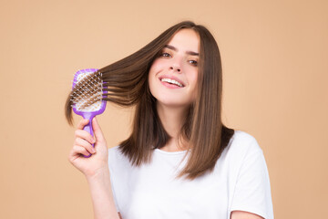 Woman brushing straight natural hair with comb. Girl combing healthy hair with hairbrush. Hair care beauty concept. Brushing Hair.