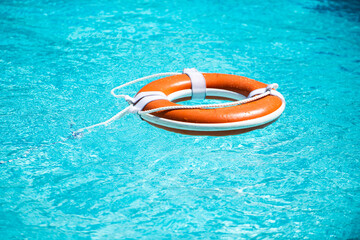 Lifebuoy in a blue sea. Weter help background.