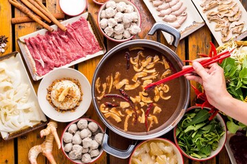 Shabu shabu on the table ready to eat, black soup