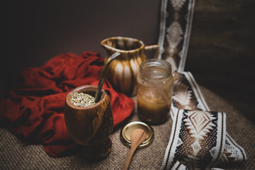 Typical Argentine mate on burlap fabric with details of gaucho guards. Traditional argentinian beverage.