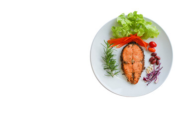 Steak salmon ,salad in white plate on white background and copy space.