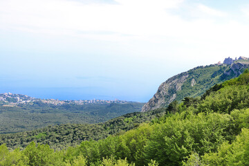 Naklejka premium View from the observation deck to Yalta, Crimea. And the top of Ai-Petri.