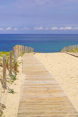 wooden path way access Atlantic beach in sand dunes in Cap-Ferret ocean france