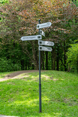 Signpost in the city park in summer.