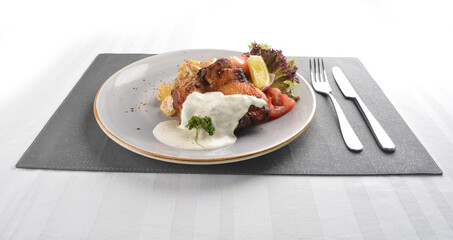 grilled bbq chicken breast meat with potato salad and lemon creamy tartar sauce on white background western halal menu