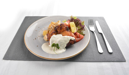 grilled bbq chicken breast meat with potato salad and lemon creamy tartar sauce on white background western halal menu