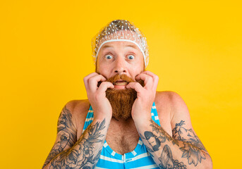 man with swimsuit and hair cap for women is ready for the summer