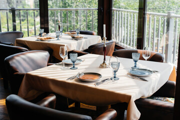 A beautifully laid table with exquisite dishes in a modern restaurant.
