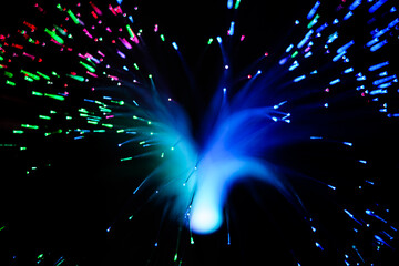 Optical fiber network cable on black background.