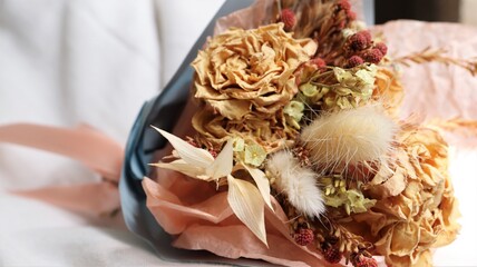 a bouquet of dried flowers on a beautiful background