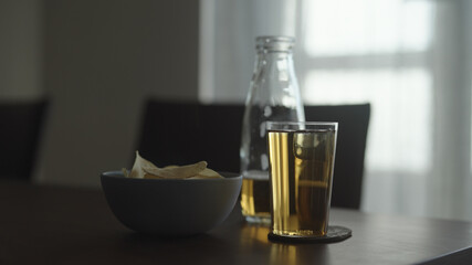 organic potato chips with soft drink on walnut table