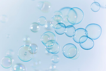 Beautiful Transparent Blue Soap Bubbles as Background.