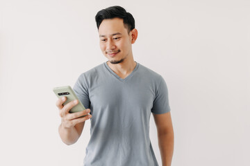 Happy Asian man use smartphone isolated on white background.