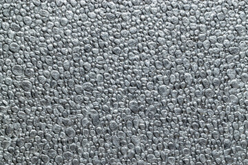 Black grain background. Gray wall for board background. Grey styrofoam foam texture or white plastic polystyrene pattern.