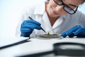 female laboratory assistant biologist soil research biotechnology