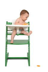 the child looking for the orange that has fallen on white background