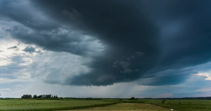 Time lapse of tornado warned supercell storm rolling through the fields in Lithuania, giant rotating wall cloud