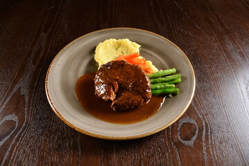 bbq grilled juicy wagyu beef tenderloin sirloin steak in brown black pepper sauce with French fries and vegetables salad dressing western cuisine menu