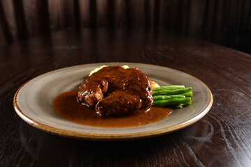 bbq grilled juicy wagyu beef tenderloin sirloin steak in brown black pepper sauce with French fries and vegetables salad dressing western cuisine menu