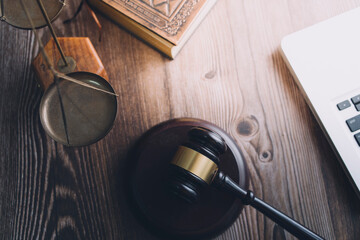 Business and lawyers discussing contract papers with brass scale on desk in office. Law, legal services, advice, justice and law concept picture with film grain effect