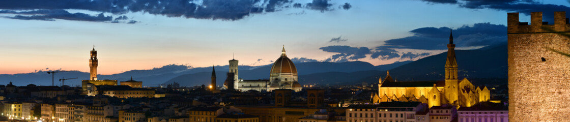 Spectacular panorama view of cityscape of Florence by night with Palace of the Town Hall, Cathedral...
