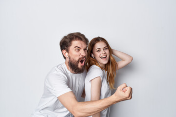 cheerful young couple in white t-shirts best friendship fun
