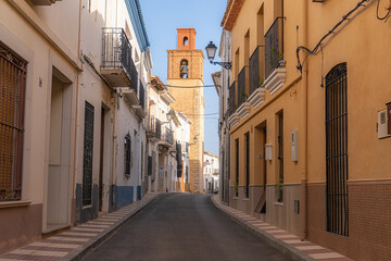 Fototapeta na wymiar Senija Street, with the bell tower in the background.