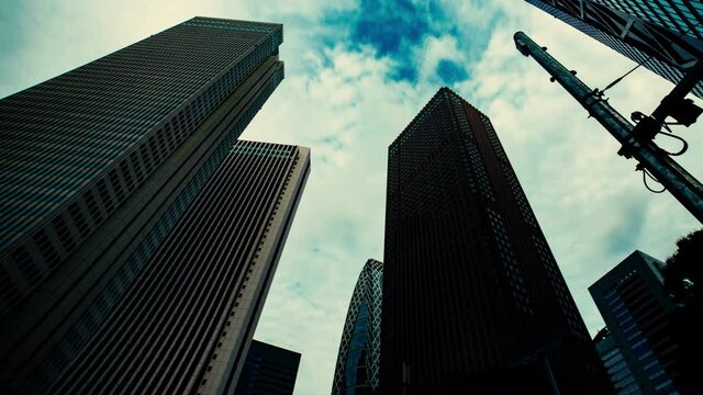 A timelapse of clowd at the building in the business town wide shot panning