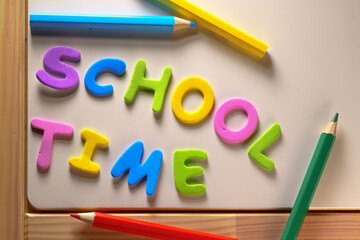 wooden table with school time text. Concepts of education from home or back to school