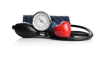 Fototapeta na wymiar Blood pressure meter and toy heart on white background