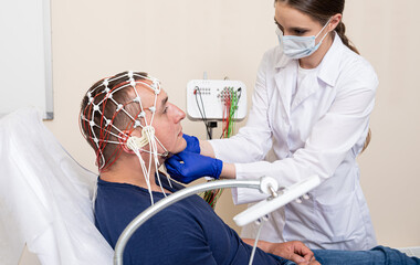 Patient brain testing using encephalography at medical center