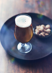 Glass of beer on wooden background. Copy space. 