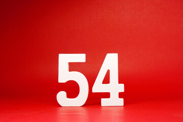 Fifty four ( 54 ) white number wooden Isolated Red Background with Copy Space - New promotion 54%...