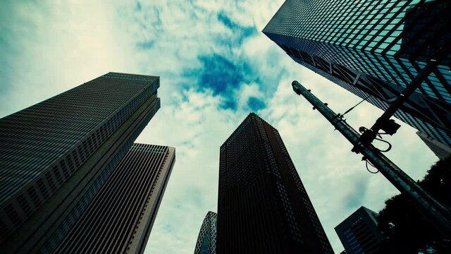 A timelapse of clowd at the building in the business town wide shot zoom