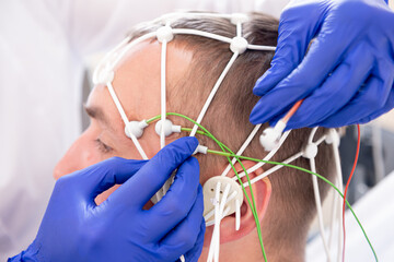 Patient brain testing using encephalography at medical center