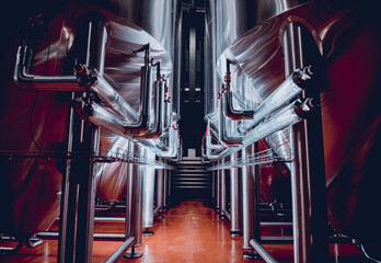 Rows of steel tanks for beer fermentation and maturation in a craft brewery