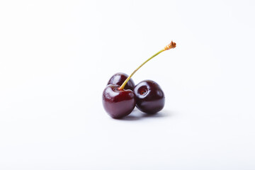 Fototapeta premium Three Cherry on a white background. Close-up, Copy space for text.