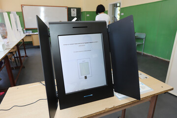 Machine for voting with sign “Bulgarian elections for parliament, 2021” and instructions for using the voting machine