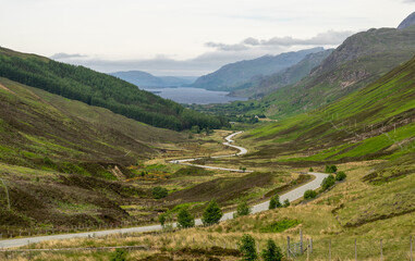A road winding down a Highland valley