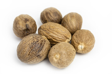 heap of whole nutmegs - myristica fragrans