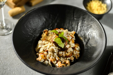 chanterelle risotto in a black plate