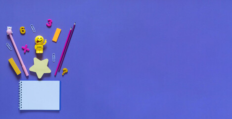 Back to school concept. School and office supplies on the office table. Violet background.Flat lay