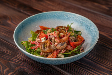 Delicious salad with boiled beef tongue, cucumber,bell pepper