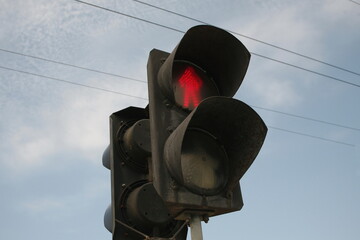 Traffic light for pedestrians with lit Red man. Do not walk sign